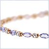 10K Two Tone Gold Tanzanite Womens Bracelet 7 5/16 Inches - 24diamonds.com